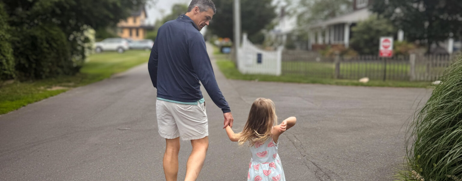 Peter walking with our niece down a road