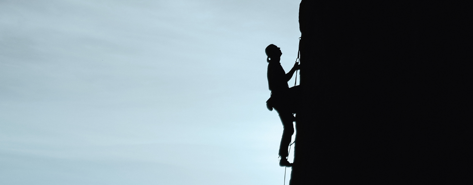 person rock climbing