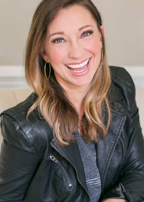 Sharon Hodde Miller sits on a couch and smiles at the camera