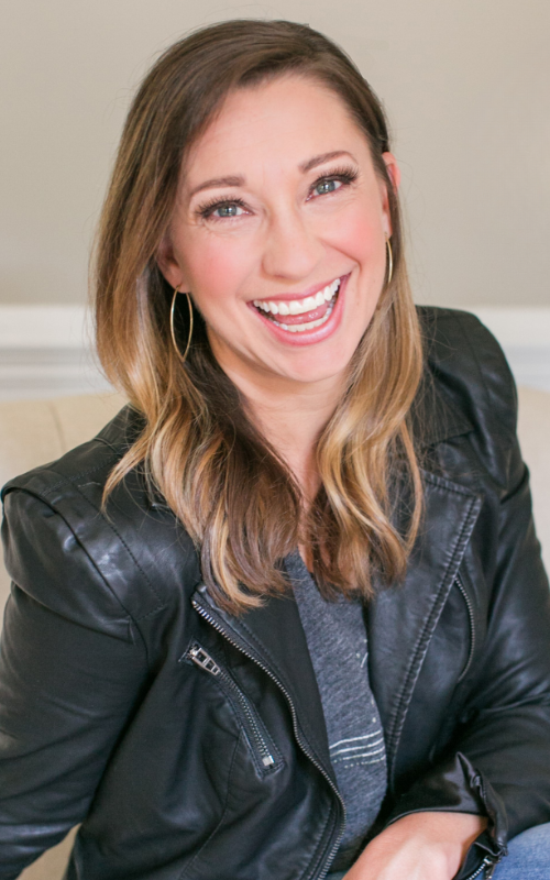 Sharon Hodde Miller sits on a couch and smiles at the camera