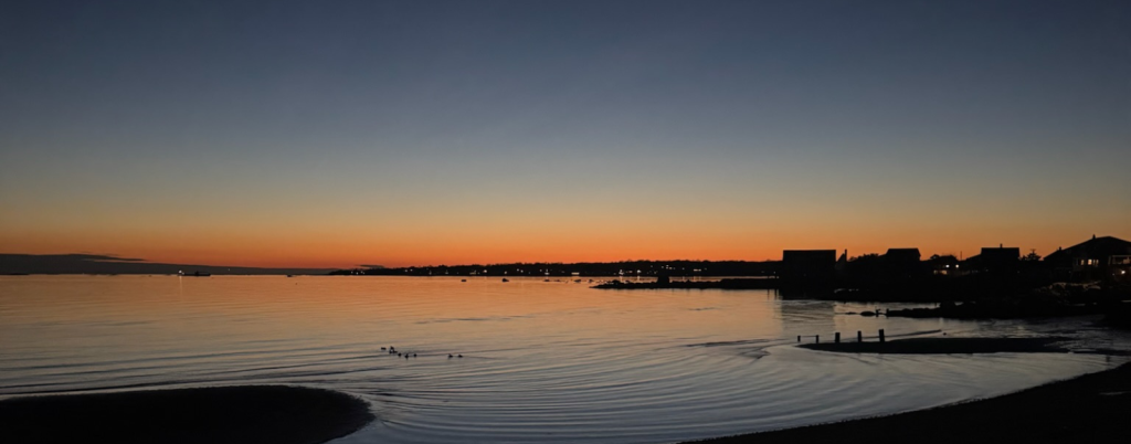 photo of the ocean at sunset
