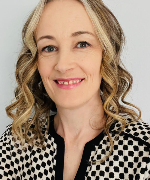 SLP Carrie Hahn poses for an indoor portrait