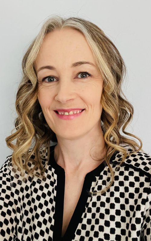 SLP Carrie Hahn poses for an indoor portrait