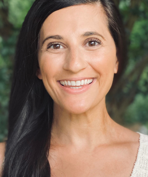 Jordan Arogeti poses for a portrait outside.