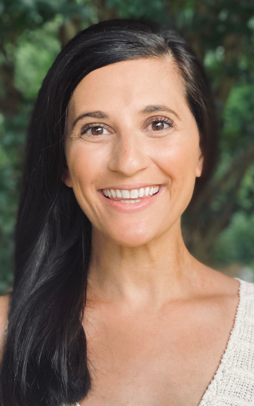 Jordan Arogeti poses for a portrait outside.