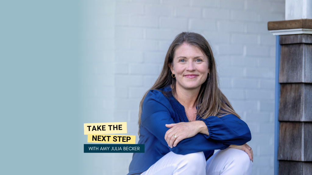 Amy Julia sits on a porch resting her arms on her knees