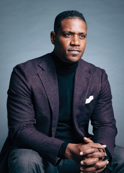 Justin Giboney poses for an indoor portrait.