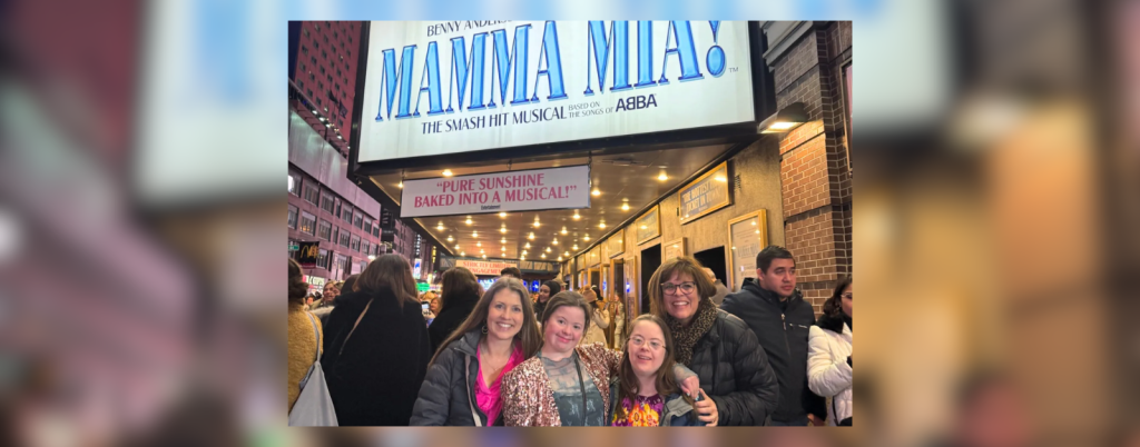 Amy Julia, Rachel, Penny, and Rachel's mom in front of the sign for Mamma Mia on Broadway