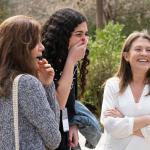 Amy Julia laughing with friends at Laity Lodge