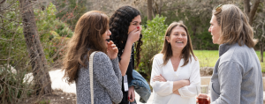 Amy Julia laughing with friends at Laity Lodge