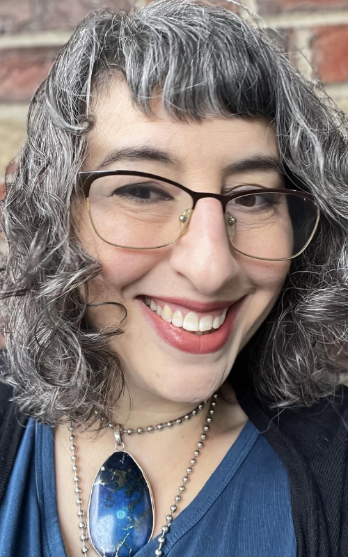 Rabbi Danya Ruttenberg smiles for a portrait