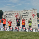 Penny showing up and getting her medal at the Special Olympics