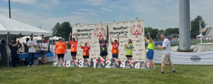 Penny showing up and getting her medal at the Special Olympics