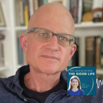 Christian Wiman smiles for portrait with bookshelves blurred in the background. In the lower right corner is the logo of the “Reimagining the Good Life with Amy Julia Becker” podcast, along with a white audio waveform graphic.