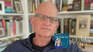 Christian Wiman smiles for portrait with bookshelves blurred in the background. In the lower right corner is the logo of the “Reimagining the Good Life with Amy Julia Becker” podcast, along with a white audio waveform graphic.
