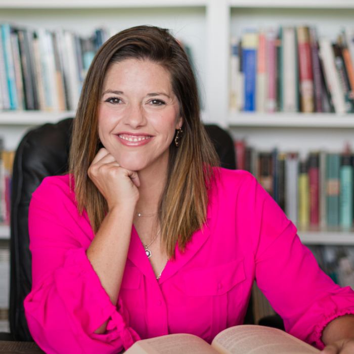 AJB-featured season 7(1560 × 628 px) – jhw dark blue graphic with intertwined blue and yellow partial circles on the left and text that says: Reimagining the Good Life with Amy Julia Becker. In the middle of the graphic is a a photo Jessica Hooten Wilson, a white woman wearing a pink shirt. She is sitting at a desk in front of full book shelves. On the far right is a photo of Amy Julia, a white woman who is wearing a blue shirt and smiling at the camera with her arms crossed in front of her