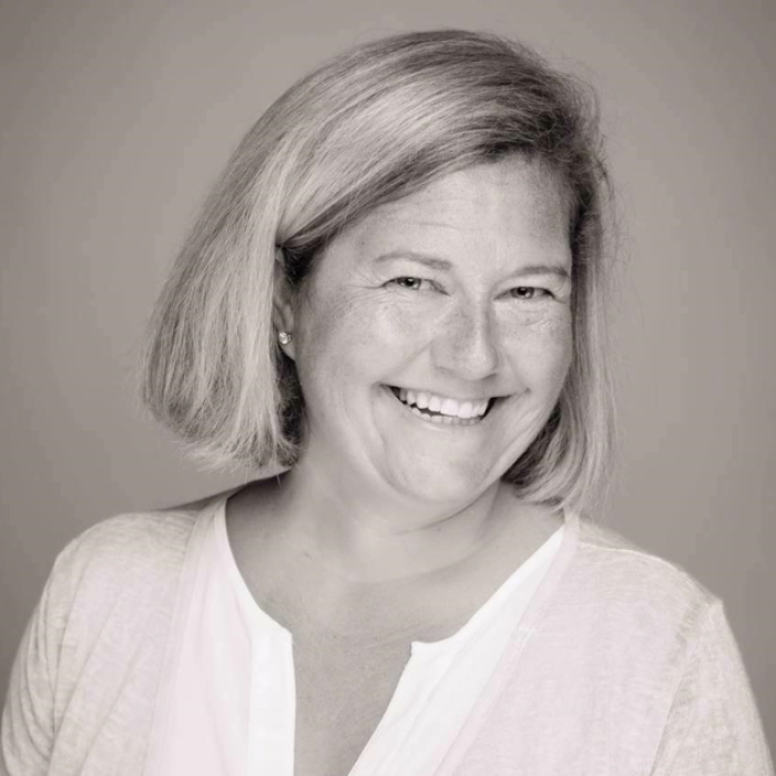 AJB-featured season 8 Adrian Wood dark blue graphic with geometric shape overlays and the Reimagining the Good Life with Amy Julia Becker podcast logo in bottom right corner. In the middle of the graphic is a photo of Adrian Wood