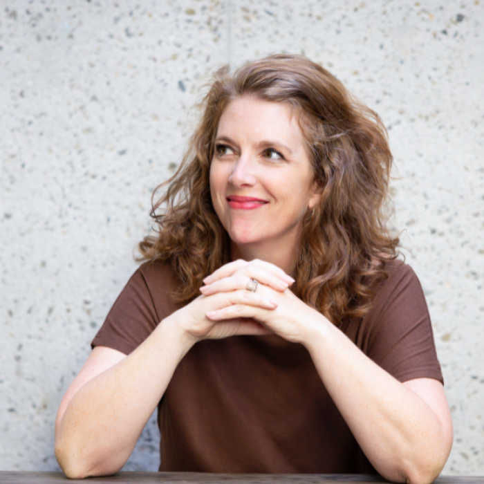 AJB-featured season 8 cara meredith dark blue graphic with geometric shape overlays and the Reimagining the Good Life with Amy Julia Becker podcast logo in bottom right corner. In the middle of the graphic is a photo of Cara Meredith