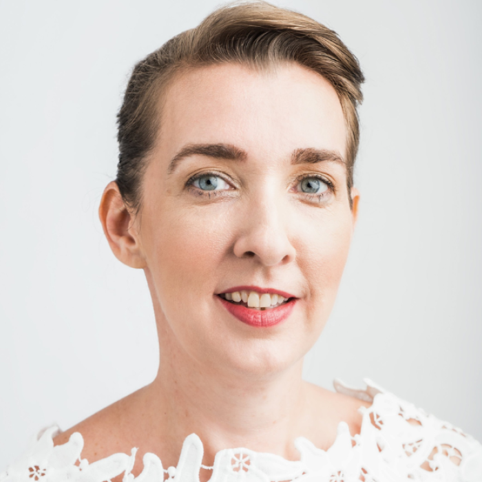 AJB-featured season 8 rosemarie carey wallace dark blue graphic with geometric shape overlays and the Reimagining the Good Life with Amy Julia Becker podcast logo in bottom right corner. In the middle of the graphic is a photo of Carey Wallace