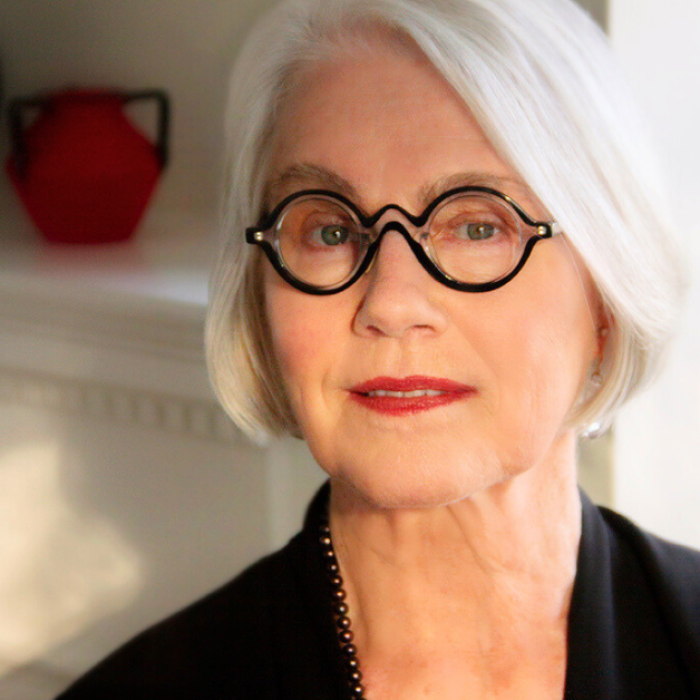 AJB-featured season 8 rosemarie garland-thomson dark blue graphic with geometric shape overlays and the Reimagining the Good Life with Amy Julia Becker podcast logo in bottom right corner. In the middle of the graphic is a photo of Rosemarie Garland-Thomson