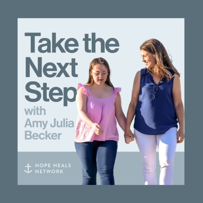 A podcast cover image with the title "Take the Next Step with Amy Julia Becker" in bold navy text on a light blue background. Beside the text, Penny and Amy Julia walk hand in hand, with Amy Julia looking toward Penny.