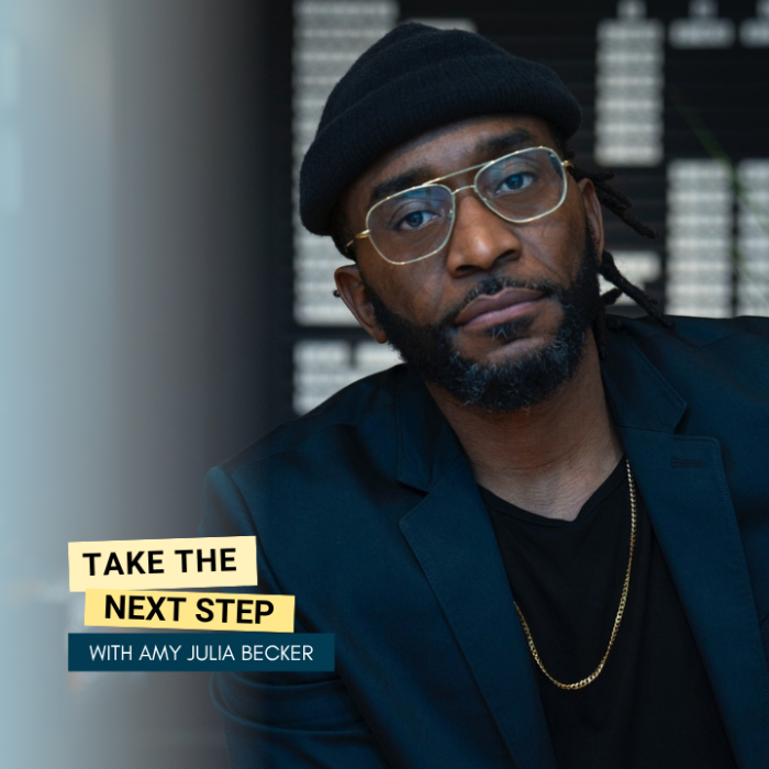 Sho Baraka poses for a portrait. Bold text in yellow text boxes near the middle of the photo says Take the Next Step.